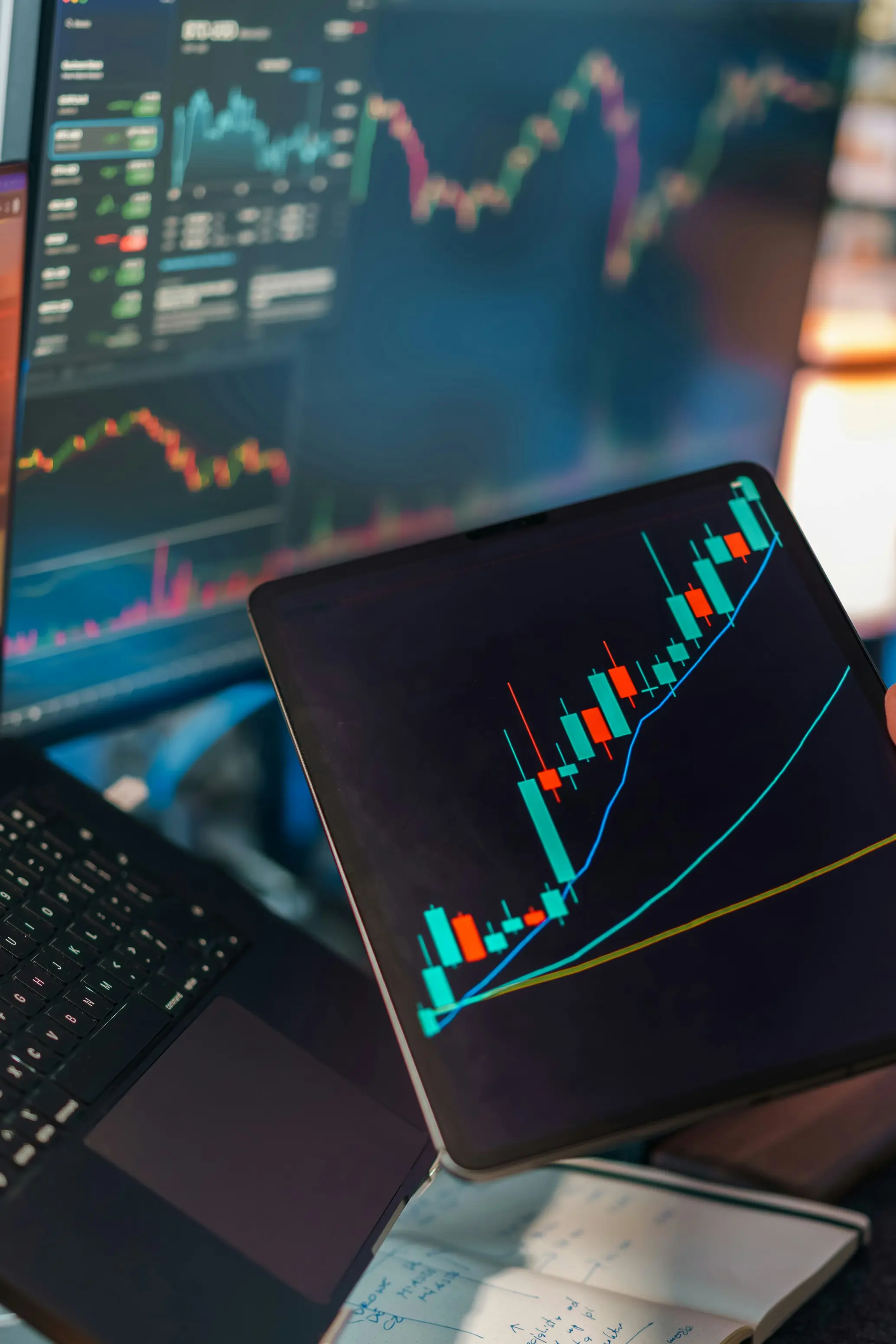 Financial trading charts on dark screens